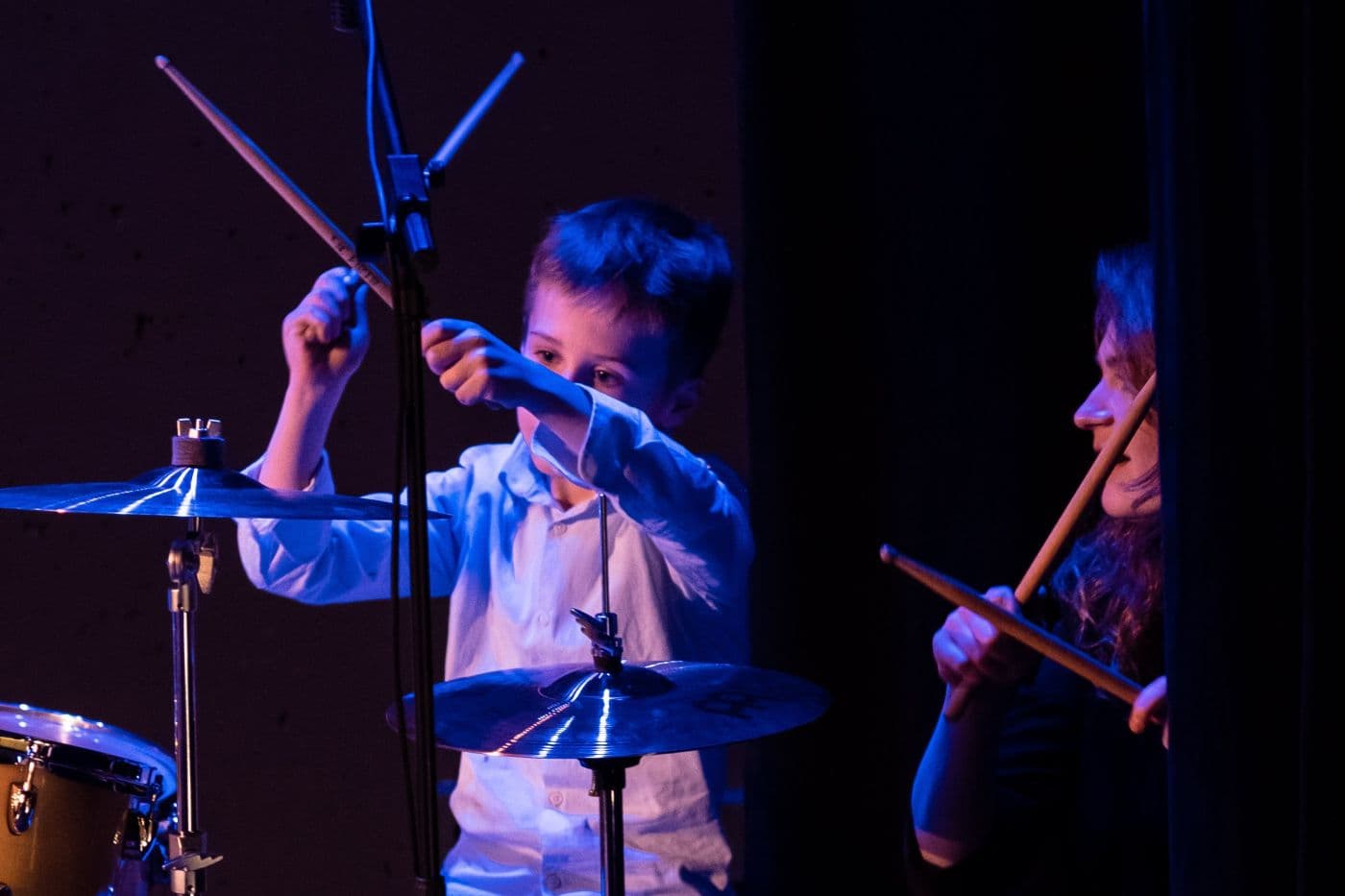 Student playing guitar at concert